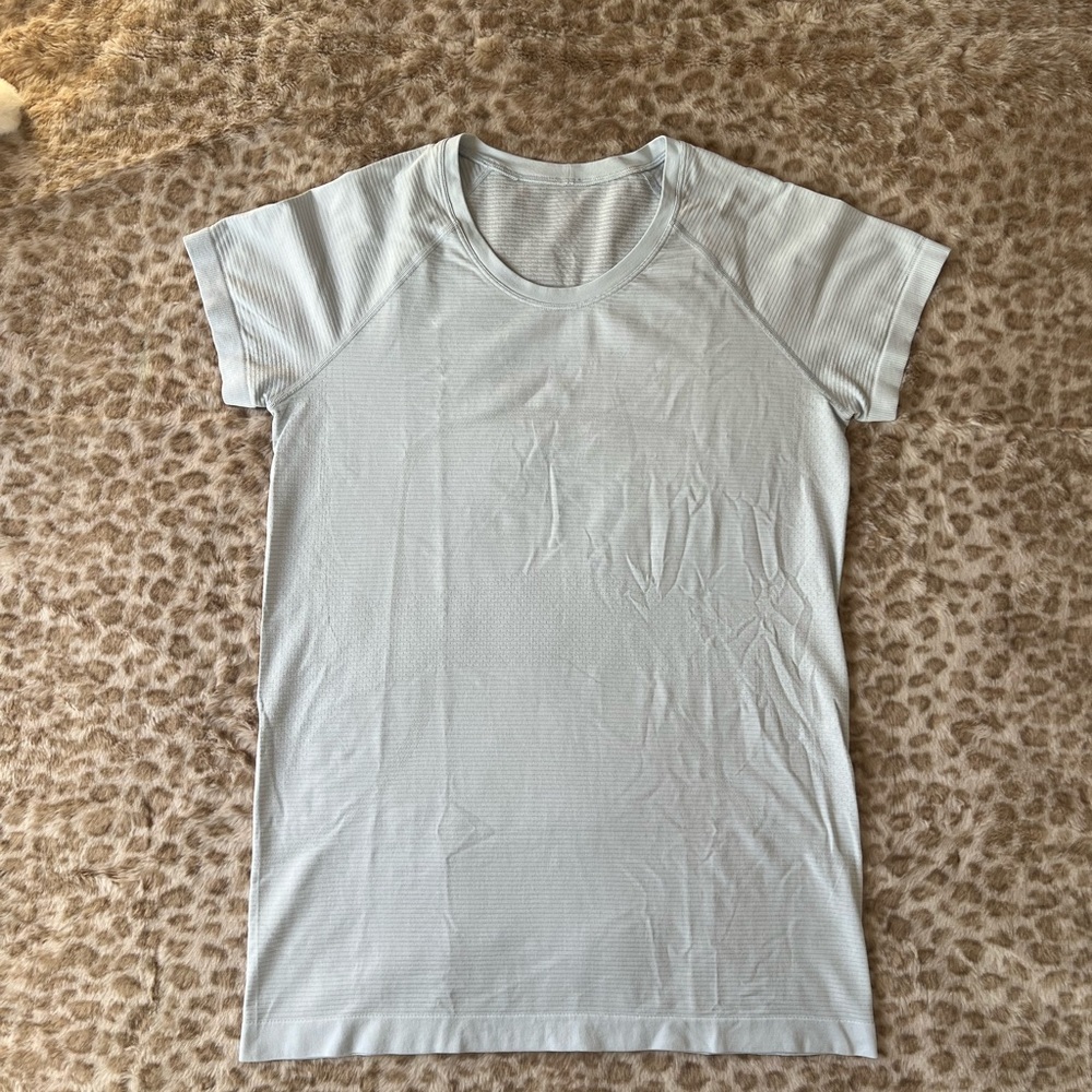 Light blue lululemon top- swiftly tech short sleeve hip length size 10